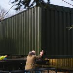 Move shipping containers without heavy equipment