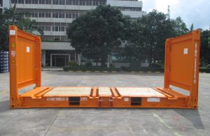 Flat rack shipping container for heavy machinery