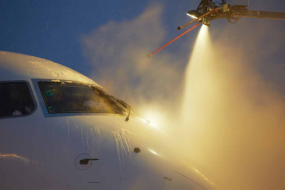 The nose of a plane being deiced.