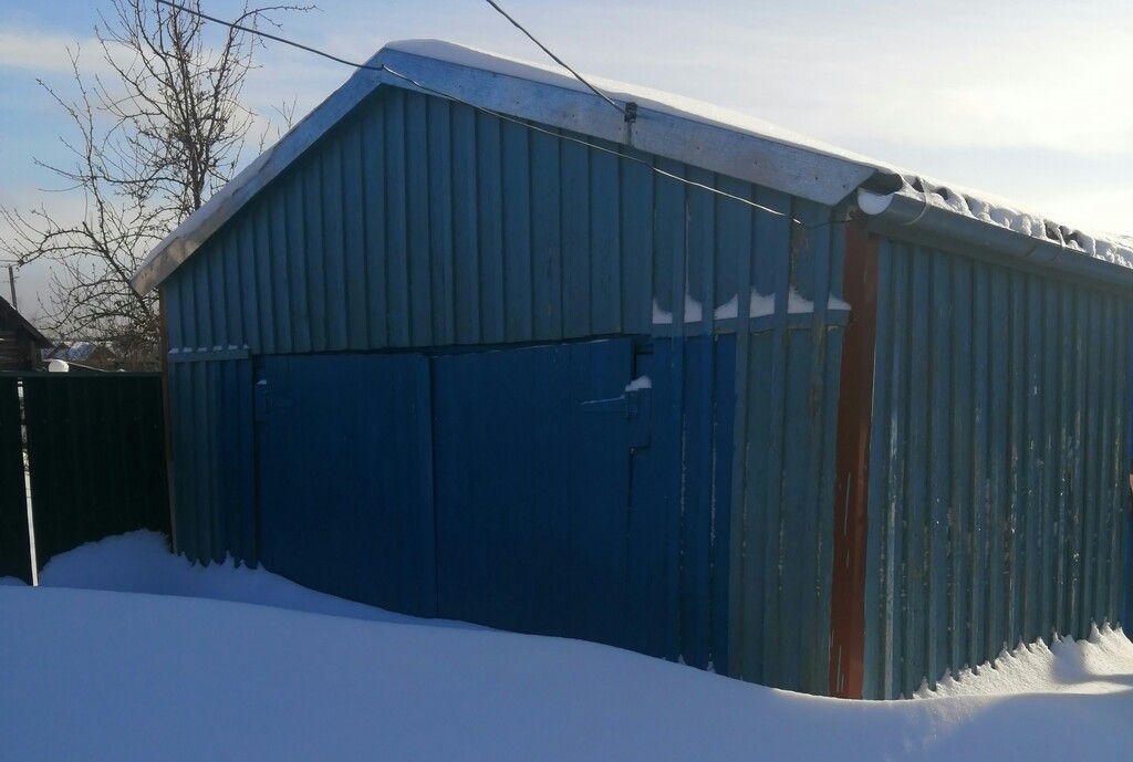 Shipping container garage during winter