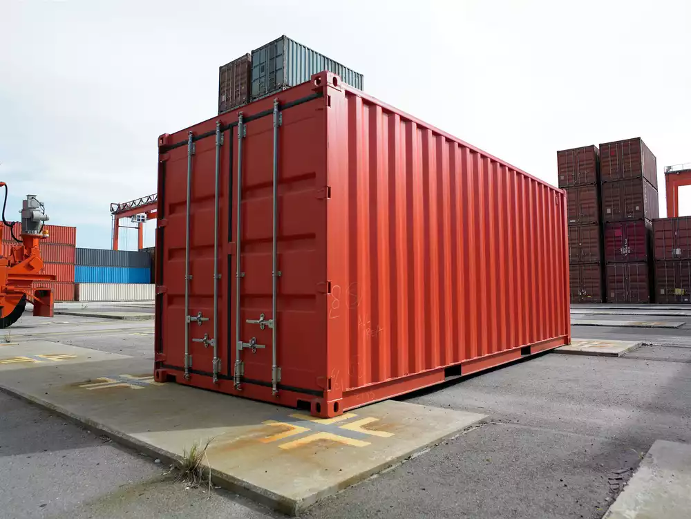 A new shipping container in a container yard.